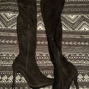 Women’s knee high stiletto boots. Never worn.